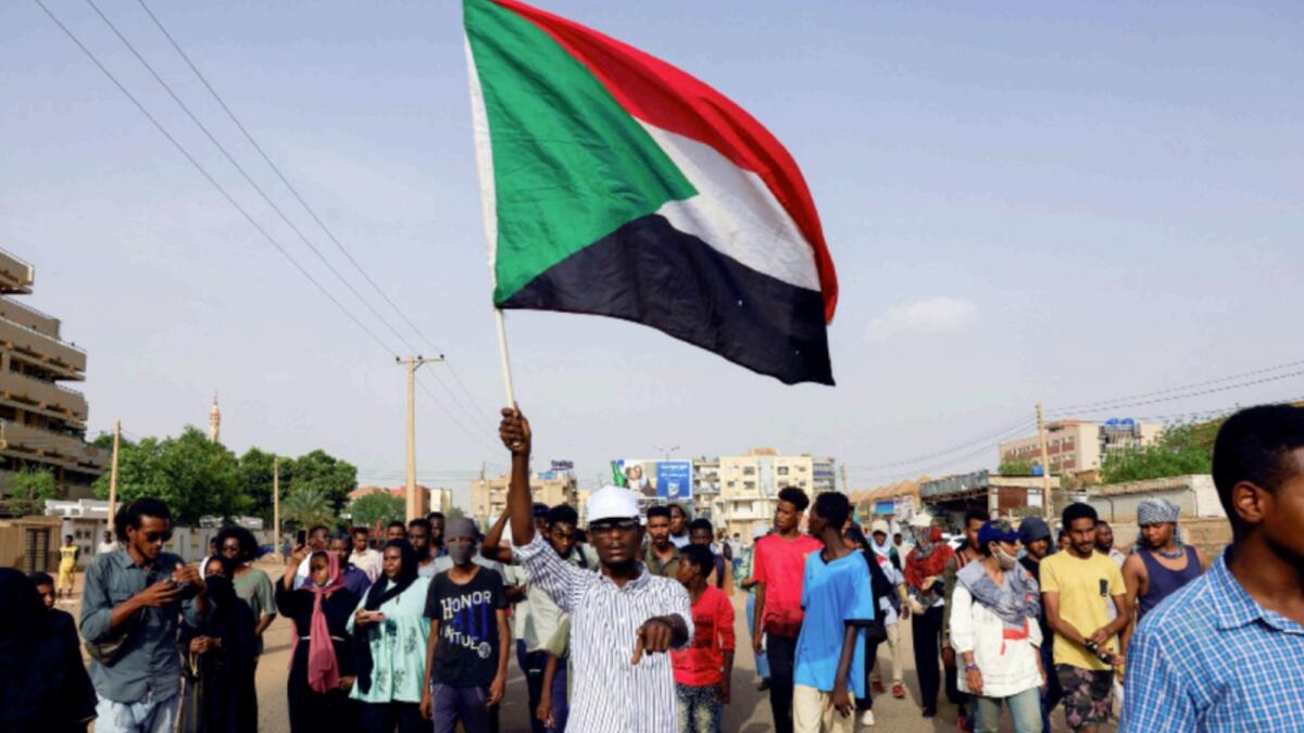 Protesters march during a rally against military rule, following the last coup and to commemorate the 3rd anniversary of demonstrations in Khartoum North. — Reuters