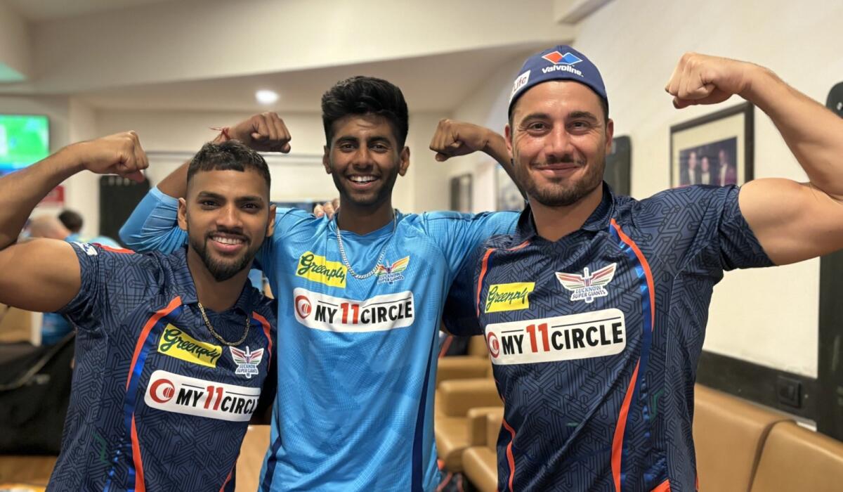 Mayank Yadav (centre) shares a light moment with LSG teammates Nicholas Pooran (left) and Marcus Stoinis. — X