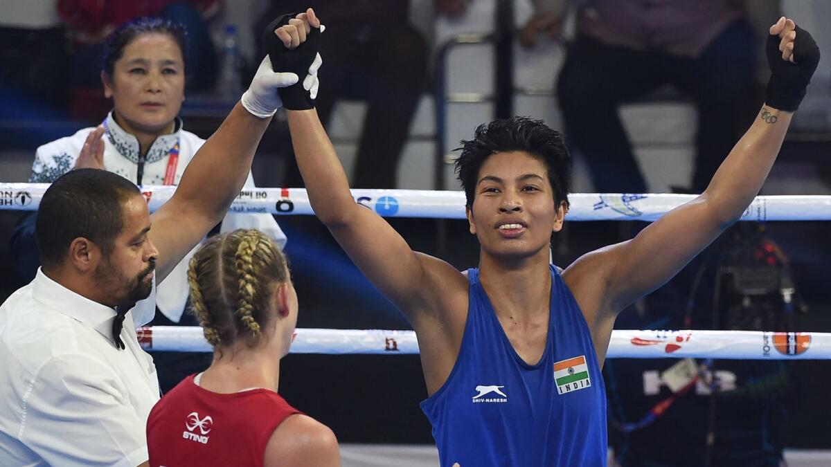 Lovlina Borgohain of India (in blue) celebrates after her win against Kaye Frances Scott of Australia during their 69kg category quarterfinal fight at the 2018 AIBA Women's World Boxing Championships. (AFP file)