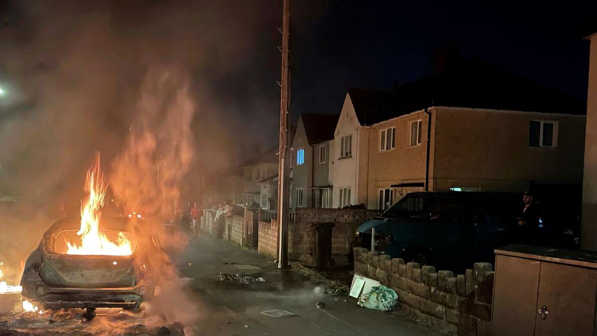 A car burns after being set on fire, on Highmead Road, Ely, in Cardiff, after a crash following a serious road traffic collision on Snowden Road in Ely in Cardiff on Tuesday.