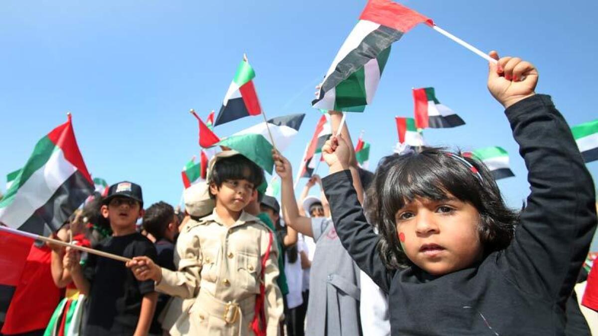 Students from the Dubai Police Kindergarten parade in costumes as part of the Flag Day celebration sat the Kite Beach. Photo by Dhes Handumon/ Khaleej Times