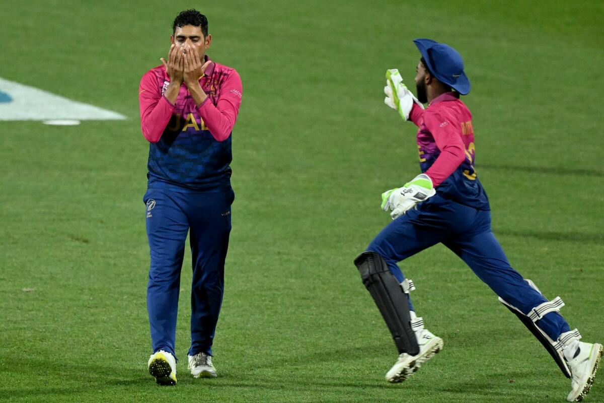 Zahoor Khan (left) celebrates his wicket of Sri Lanka's Pathum Nissanka during the ICC T20 World Cup. (AFP)