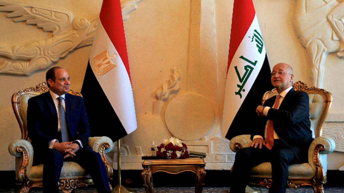 Iraqi President Barham Salih, right, meets with visiting Egypt's President Abdel Fattah el-Sissi, upon the latter's arrival in Baghdad. Photo: AFP