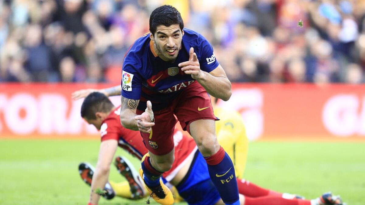 Suarez hits winner as Barca sink nine-man Atletico