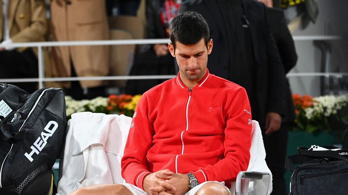 Novak Djokovic reacts at the end of the men's final  against winner Rafael Nadal