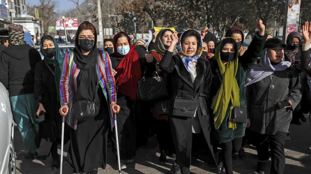 Afghan women chant slogans during a protest against the ban on university education for women, in Kabul, Afghanistan,  on December 22, 2022. — AP
