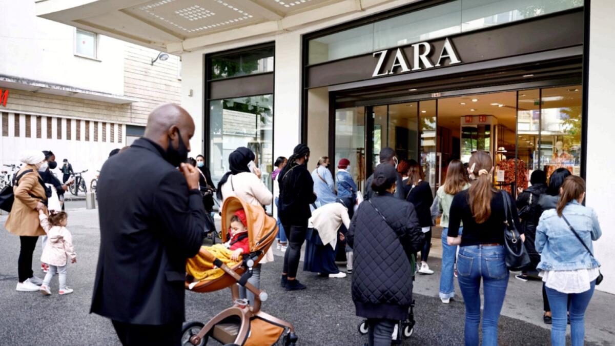 People enter a shop in Nantes, France. — Reuters