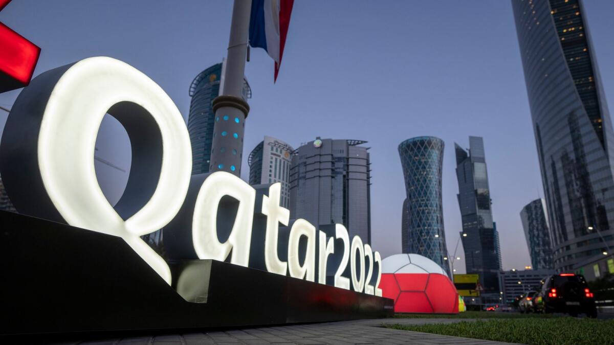 Branding is displayed near the Doha Exhibition and Convention Center, in Doha, Qatar, on March 31, 2022. — AP