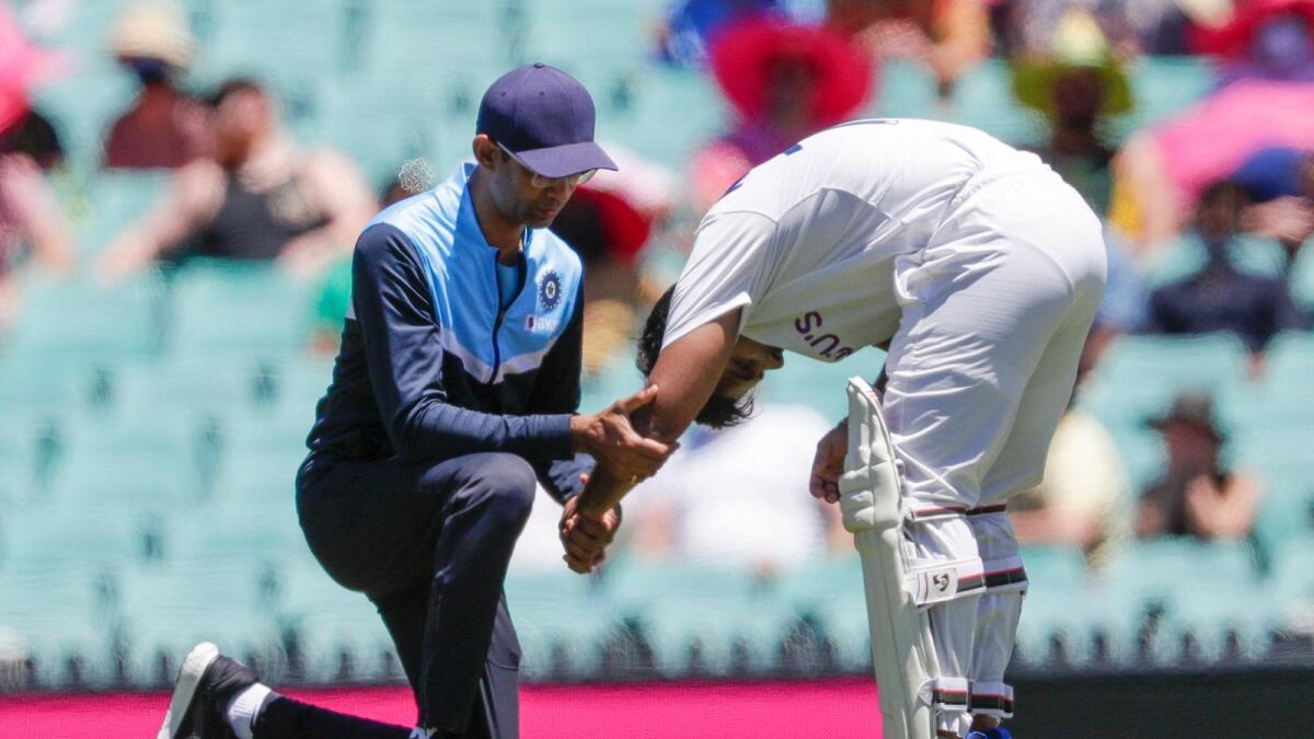 Rishabh Pant receives treatment to his arm after he was hit while batting during day three of the third Test. — AP