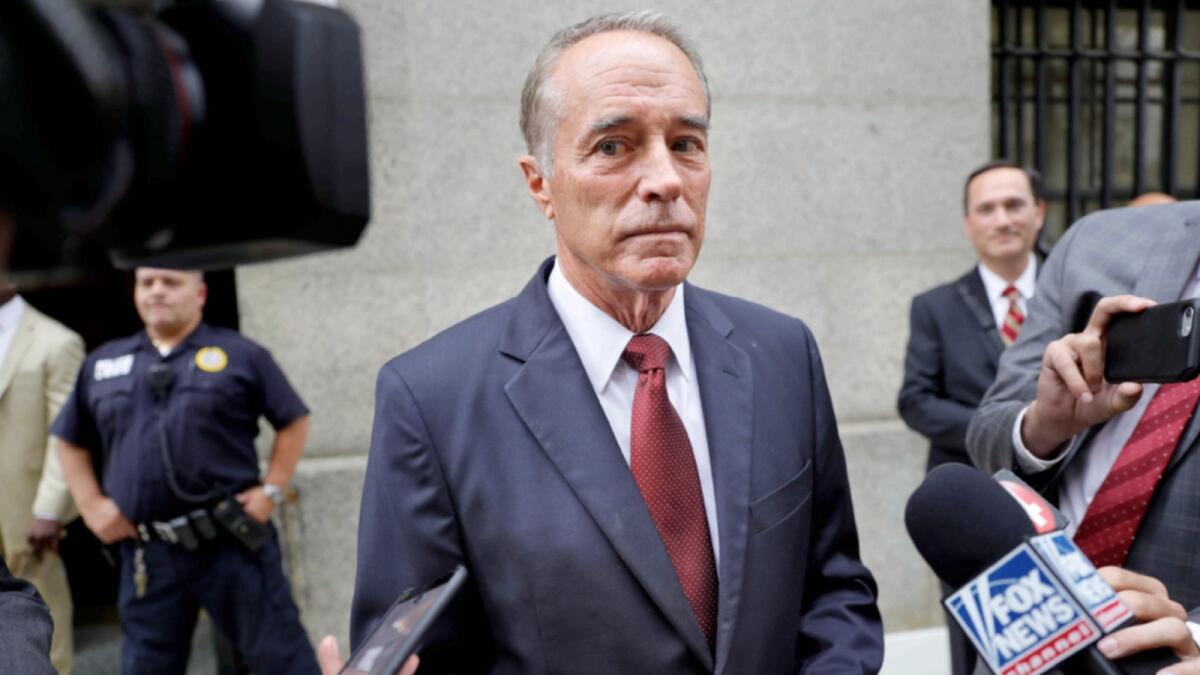 US Rep Chris Collins, R-N.Y., speaks to reporters as he leaves the courthouse after a pretrial hearing in his insider-trading case, in New York in 2019. Collins, the first member of Congress to endorse Trump to be president, was sentenced to two years and two months in federal prison after admitting he helped his son and others dodge $800,000 in stock market losses when he learned that a drug trial by a small pharmaceutical company had failed. — AP file