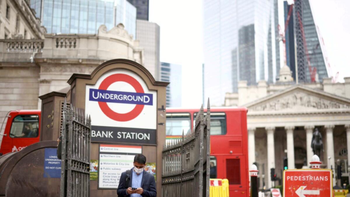 A person exits Bank underground station in the City of London financial district in London. — Reuters file