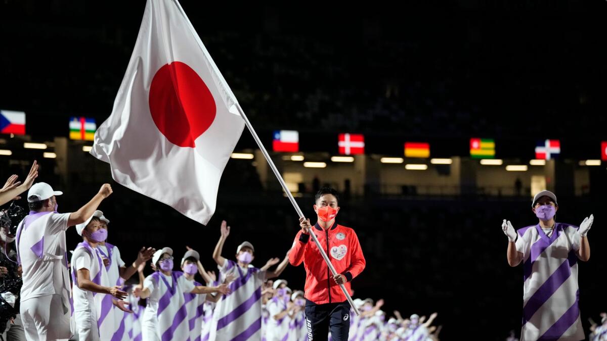 Japan’s flag bearer Iwabuchi Koy enters the stadium during the closing ceremony for the 2020 Paralympics at the National Stadium in Tokyo on Sunday. — AP