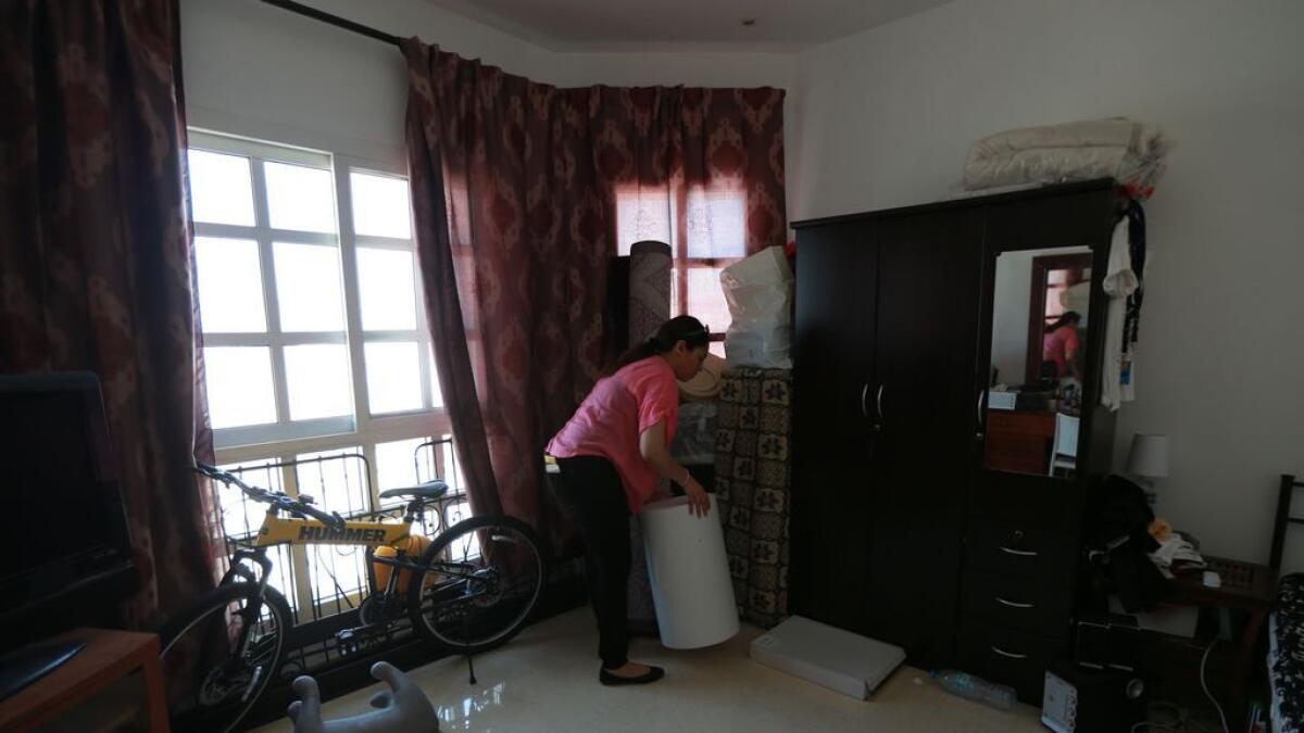 Rasha Hassan, a complainant residing at the Mohamed Bin Zayed City in Abu Dhabi sector 7 (Villa no. 103) removes some of her belongings. 