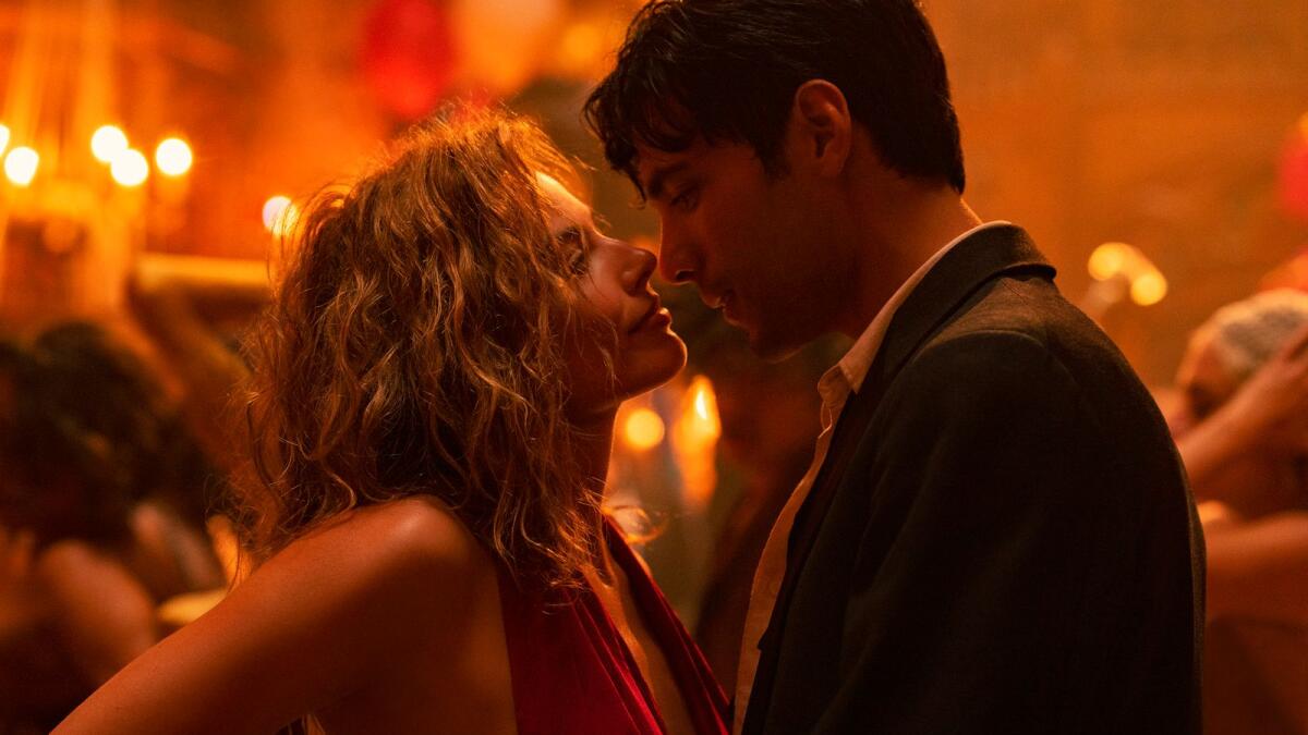 This image released by Paramount Pictures shows Margot Robbie, left, and Diego Calva in 'Babylon.'