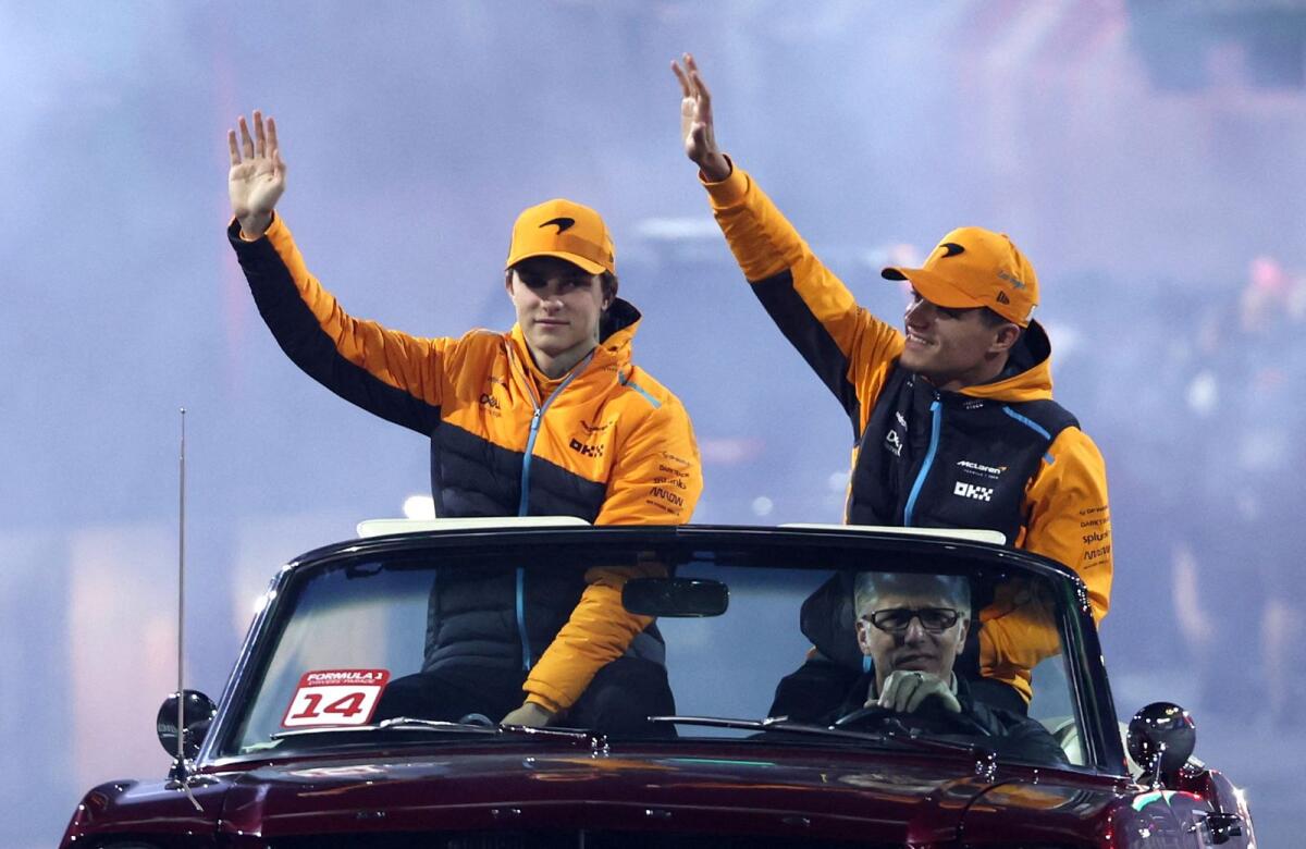 McLaren's Lando Norris and Oscar Piastri during a drivers parade. - Reuters File