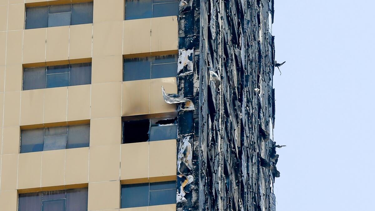 Flames spread through Abbco Tower in Al Nahda shortly after smoke alarms sounded in the building's 300-plus apartments.