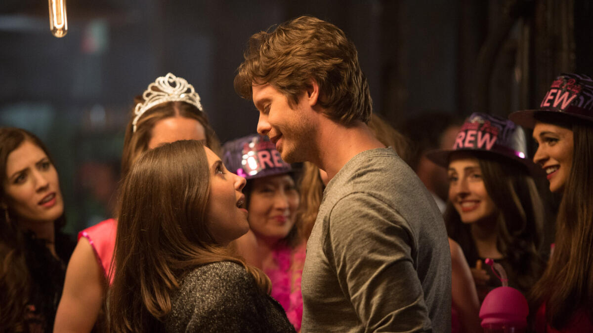 This image released by  Warner Bros. Entertainment Inc. shows Alison Brie, left, and Anders Holm in a scene from, 'How to Be Single.' (Jojo Whilden/Warner Bros. Entertainment via AP) Inc.
