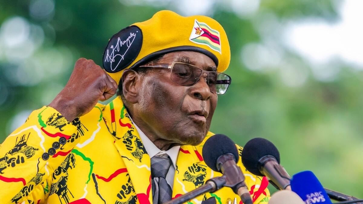 Robert Mugabe addressing party members and supporters gathered at his party headquarters.- AFP