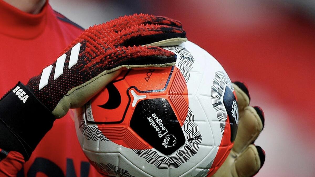 Manchester United goalkeeper David de Gea holds a ball during warm-up. - Reuters file.