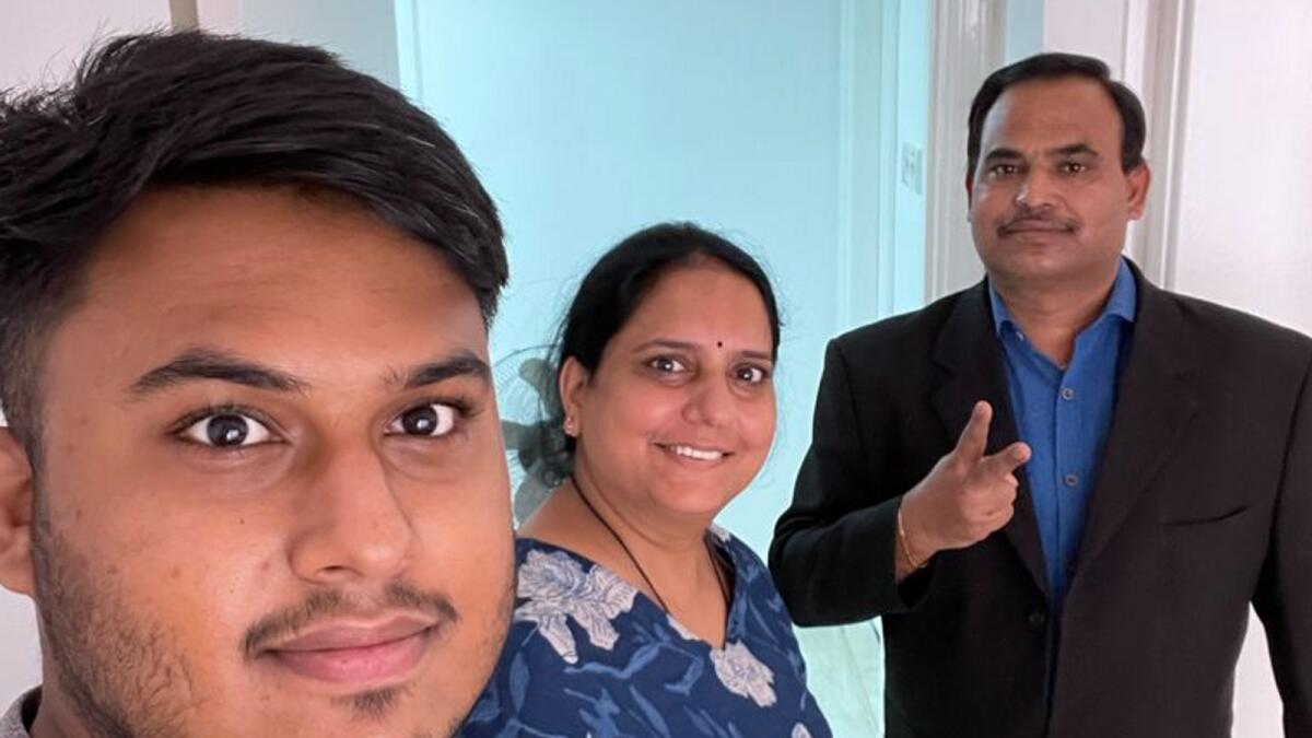 Abu Dhabi resident Kamlesh Tiwari with his wife Preeti and son Pritesh at their home in the capital city.