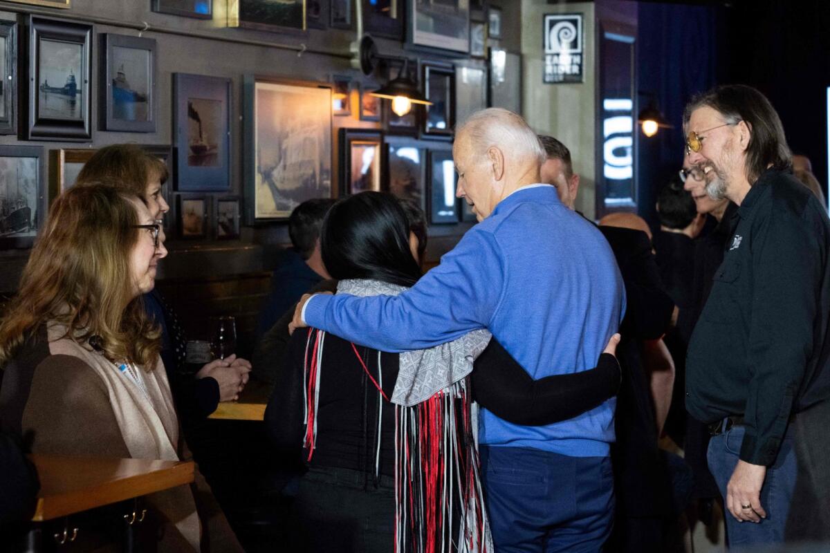 US President Joe Biden visits with patrons at the Cedar Lounge Tap Room at Earth Rider Brewery after speaking about the Bipartisan Infrastructure Law at the brewery in Superior, Wisconsin, on January 25, 2024. — AFP