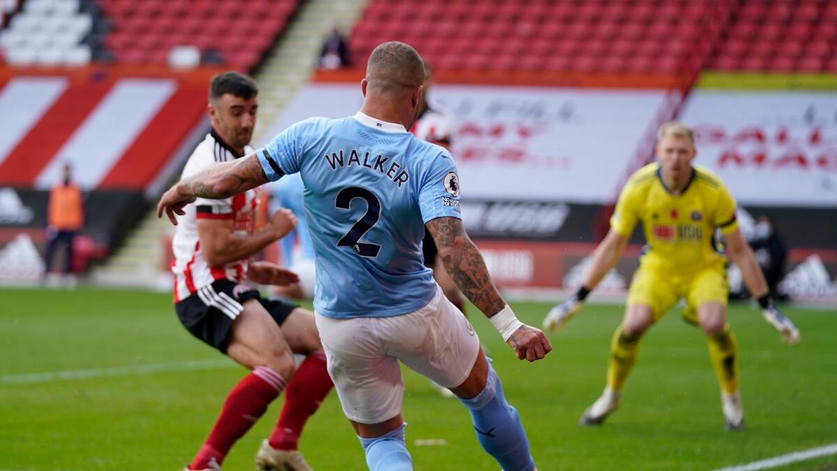 Manchester City's Kyle Walker kicks the ball during the English Premier League match against Sheffield United.— AP