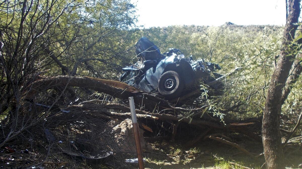 Woman found alive 6 days after car lands on tree