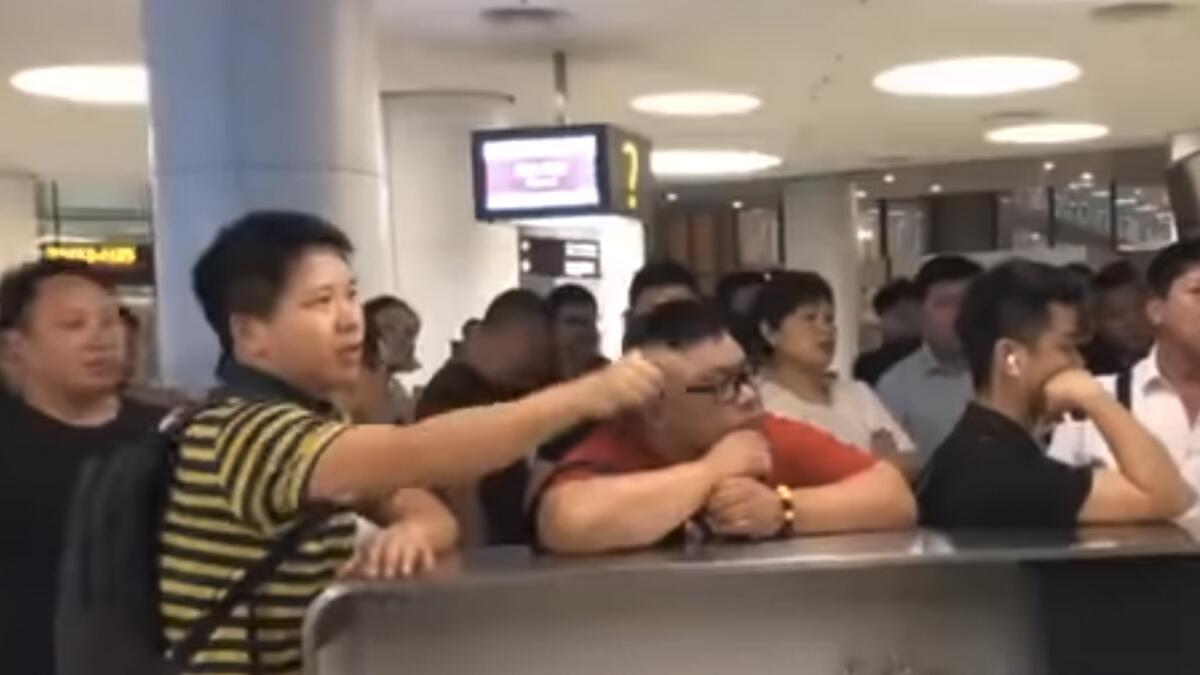 Video: Passenger demands airport workers kneel due to delayed flight
