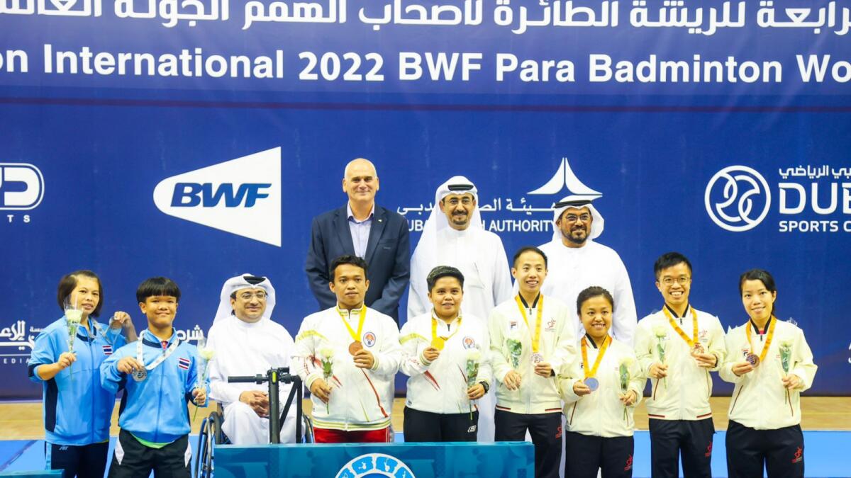 Fazza Championships Director Majid Al Usaimi (third from left) and President Thani Juma Berregad (first from right, second row) pose with the champions of mixed doubles SH6 event. (Supplied photo)