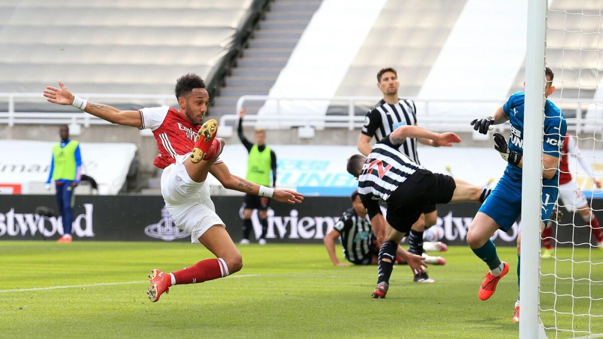 Arsenal's Pierre-Emerick Aubameyang scores a goal against Newcastle. — Reuters