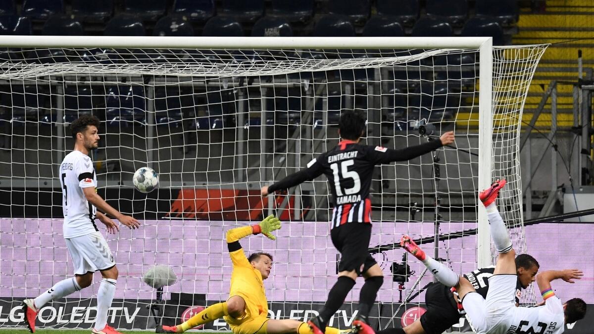 Eintracht Frankfurt's Timothy Chandler scores their third goal (Reuters)