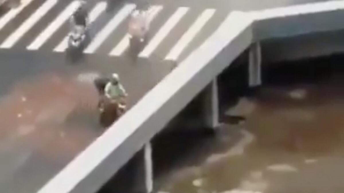 Video: Bridge eats up vehicles in bizarre optical illusion