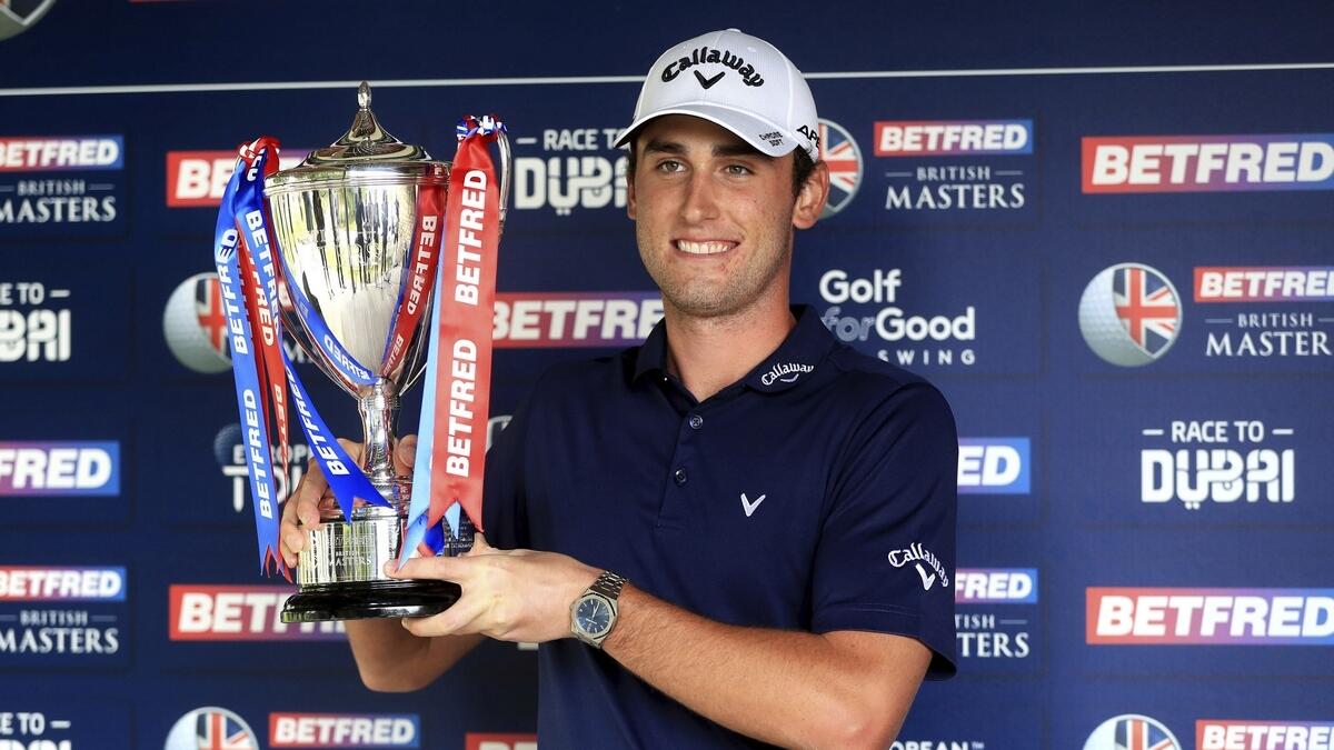 Italy's Renato Paratore poses with the trophy after winning the British Masters golf tournament at Close House Golf Club, Newcastle