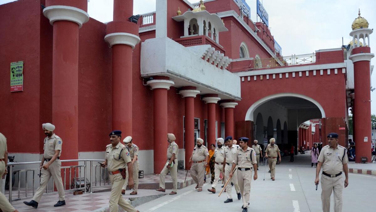 Cops deployed at the Amritsar railway station on Saturday. (Photo: PTI)