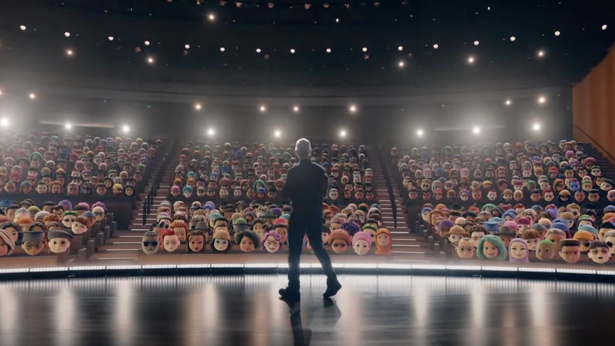 Apple CEO Tim Cook addressing a virtual crowd of Memojis during his WWDC keynote on Monday.