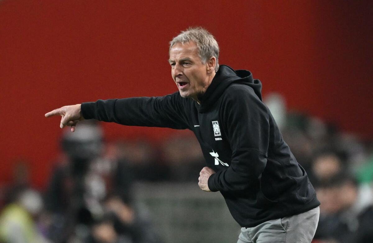 Jurgen Klinsmann directs his players during a friendly match against Uruguay in Seoul on Tuesday. — AFP