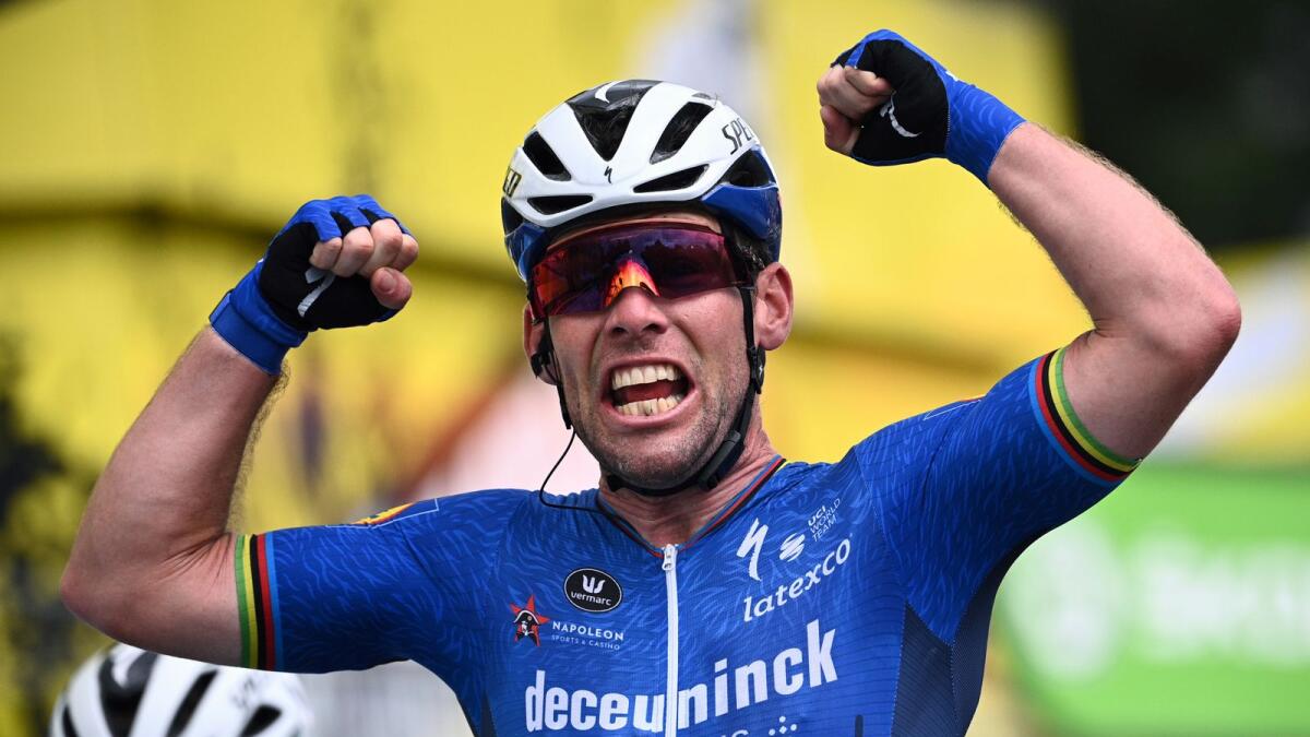 Britain's Mark Cavendish celebrates as he crosses the finish line to win the fourth stage of the Tour de France on Tuesday. (AP)