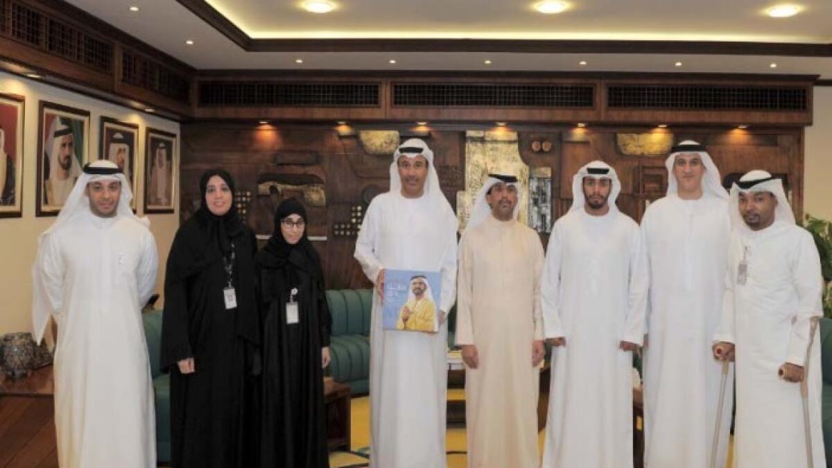 Lootah gifts Shaikh Mohammeds book in Braille to disabled employees