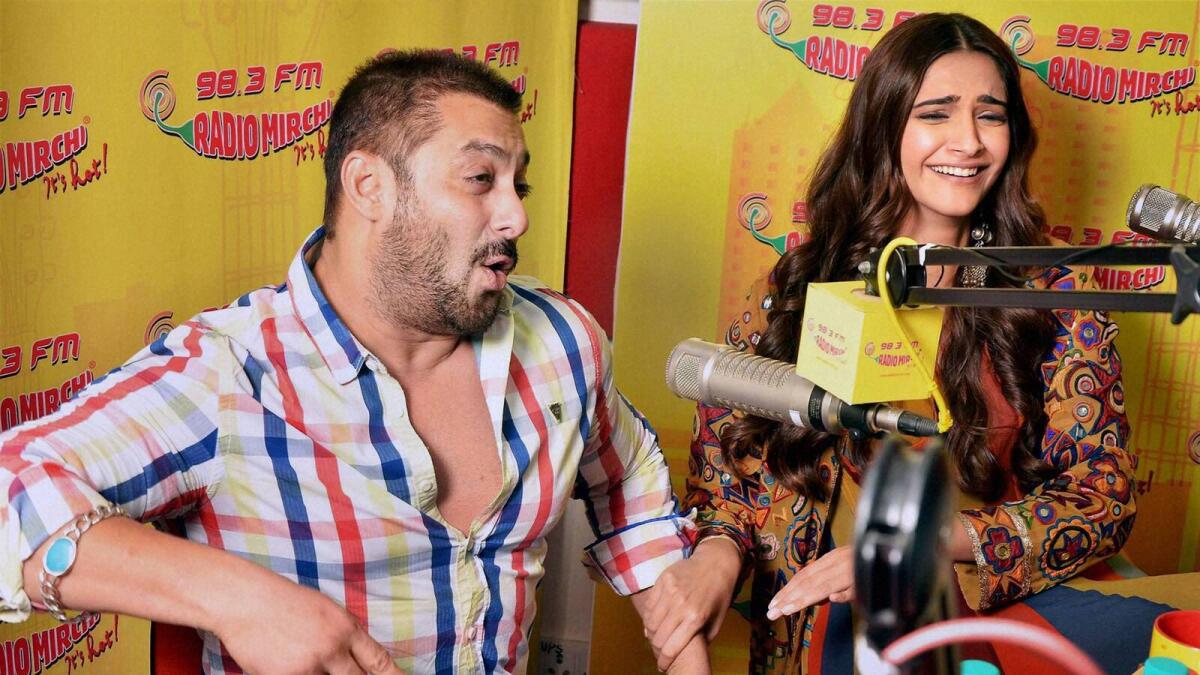 Mumbai: Actor Salman Khan with actress Sonam Kapoor at Radio Mirchi studio for the promotion of their upcoming film 'Prem Ratan Dhan Payo' in Mumbai on Monday. PTI Photo(PTI11_3_2015_000028A)
