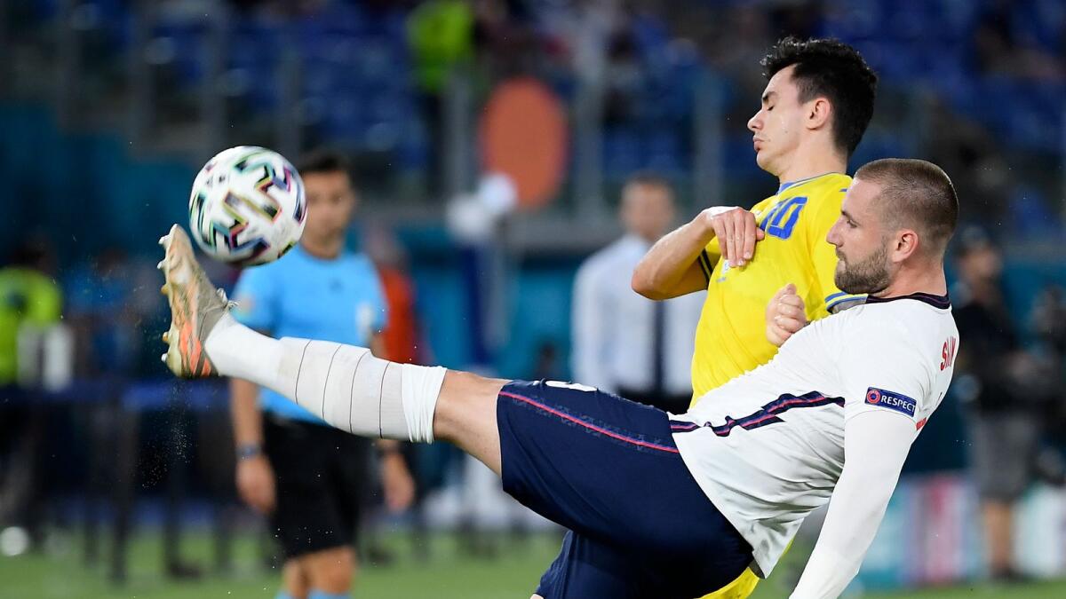 England's Luke Shaw clears the ball away from Ukraine's Mykola Shaparenko during the Euro 2020 championship quarterfinal. — AP