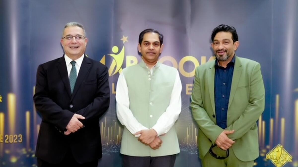 Iqbal Marconi, CEO, ECH Digital is pictured with Ghassan Aouad, chancellor of Abu Dhabi University, alongside Dr Sanjay Sudhir, Indian ambassador to the UAE.