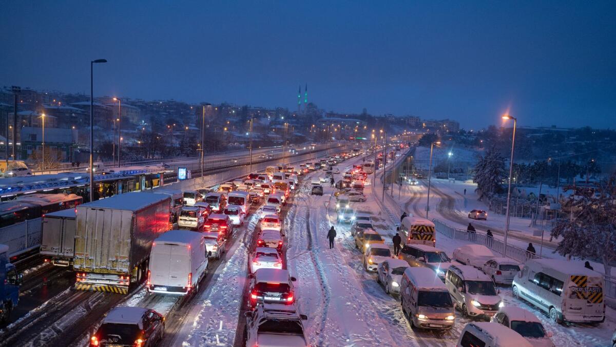 Local residents are stuck in their car due to heavy snowfall in Istanbul on January 24, 2022. (Photo: AFP)
