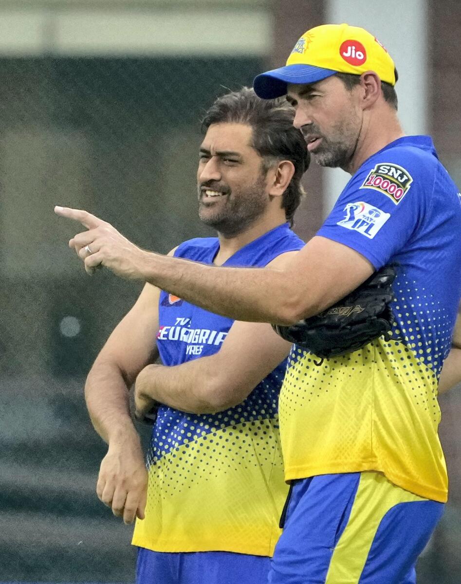 Chennai: Chennai Super Kings captain MS Dhoni and team coach Stephen Fleming during a practice session. - PTI