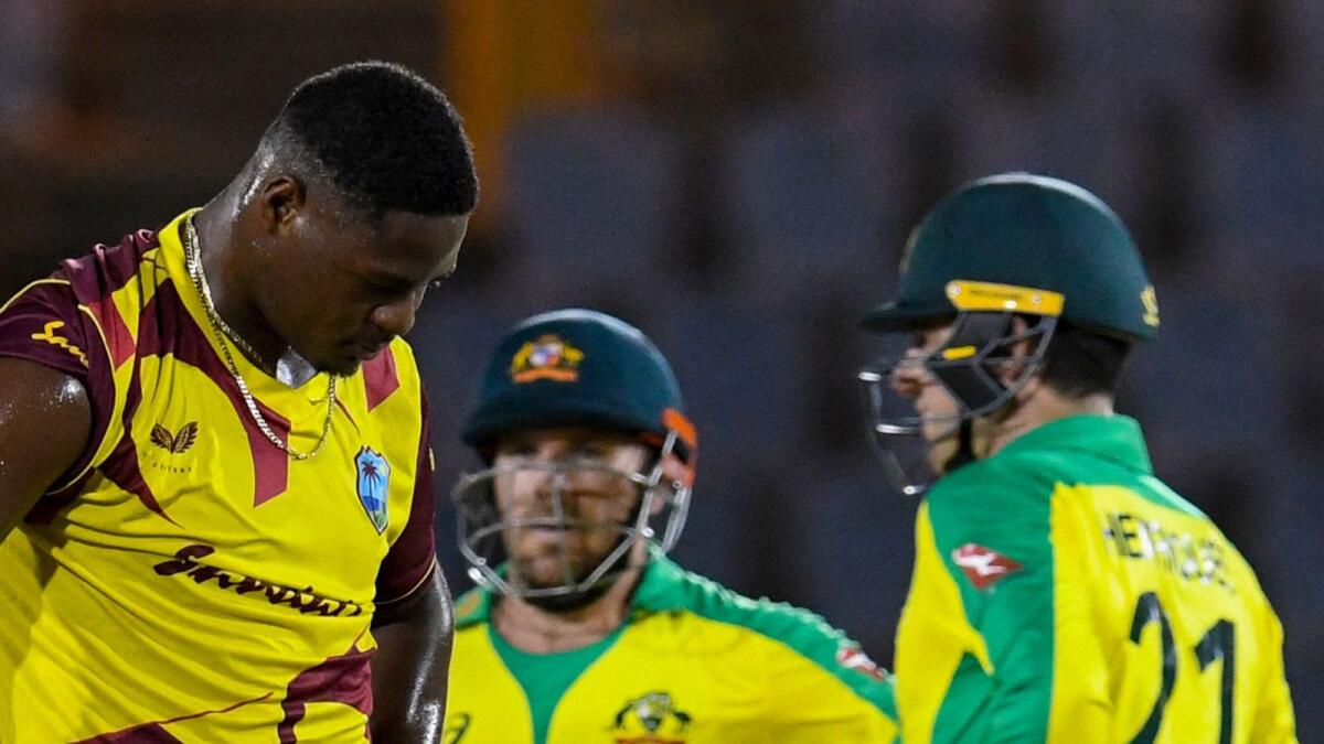 Oshane Thomas (Lleft of West Indies expresses disappointment as Aaron Finch (centre) of Australia get runs off his bowling during the 5th and final T20I between Australia and West Indies. — AFP