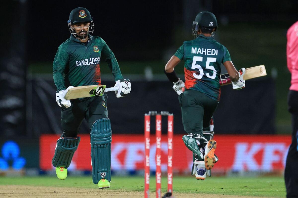 Bangladesh's Litton Das (left) and teammate Mahedi Hasan during the first T20 match against New Zealand. — AFP