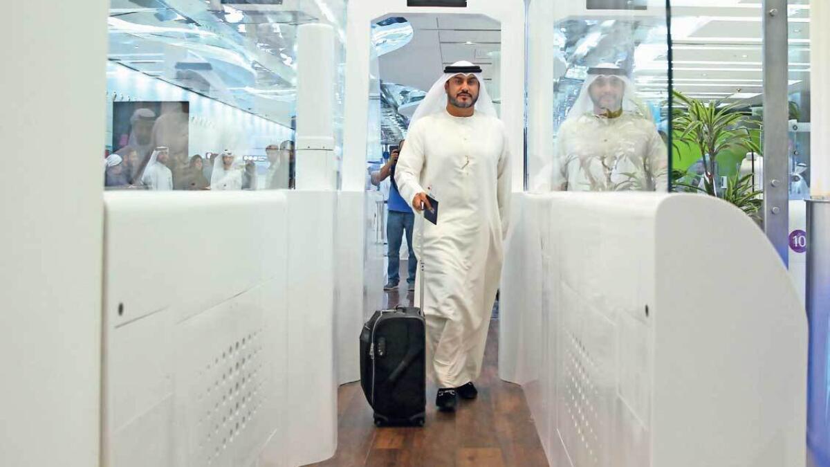 Dubai International Airport, passport, travellers,Smart Tunnel,  