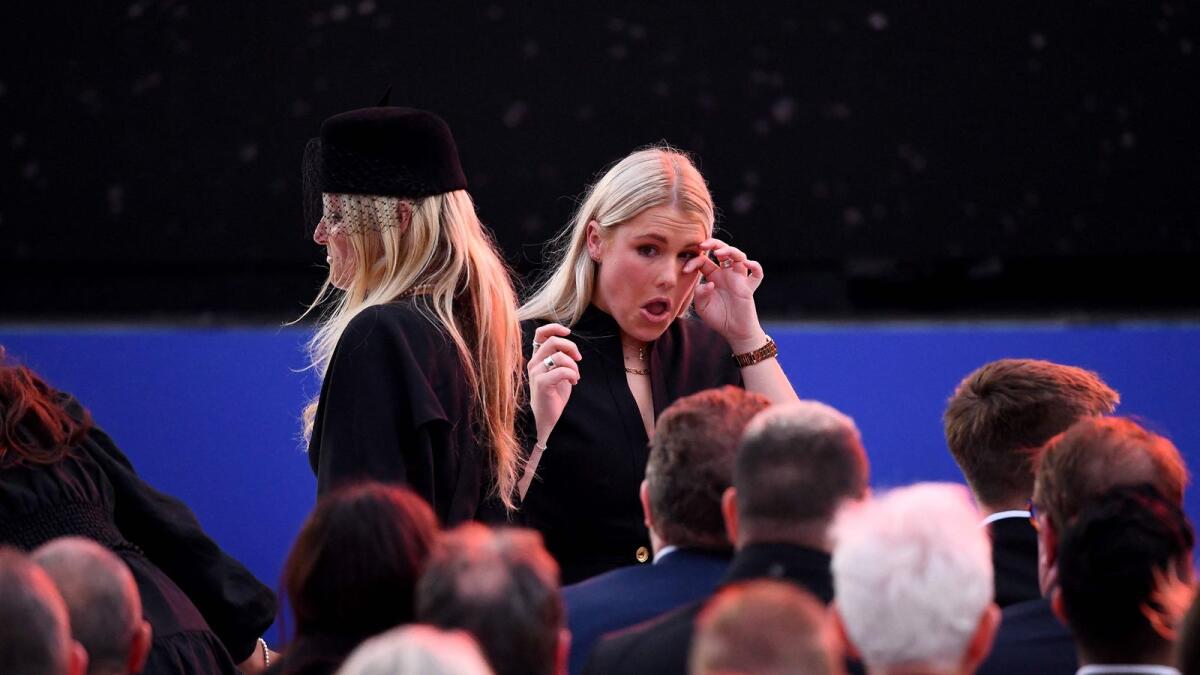 Shane Warne's daughter Brooke Warne receives guests during the state memorial service. — AFP