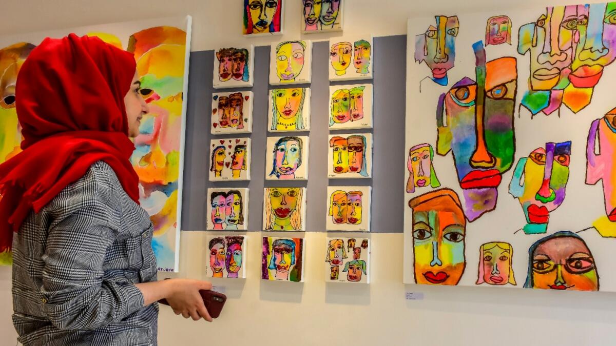 A visitor explores artworks by at a final exhibition by students of Mawaheb on display at The Workshop Dubai in Jumeirah. Photo by Shihab/KT