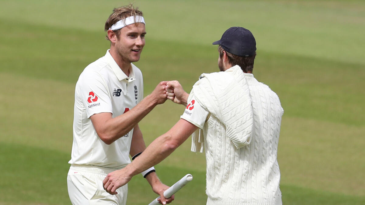England's Stuart Broad (left) celebrates winning the Test series with teammate Chris Woakes. - Reuters