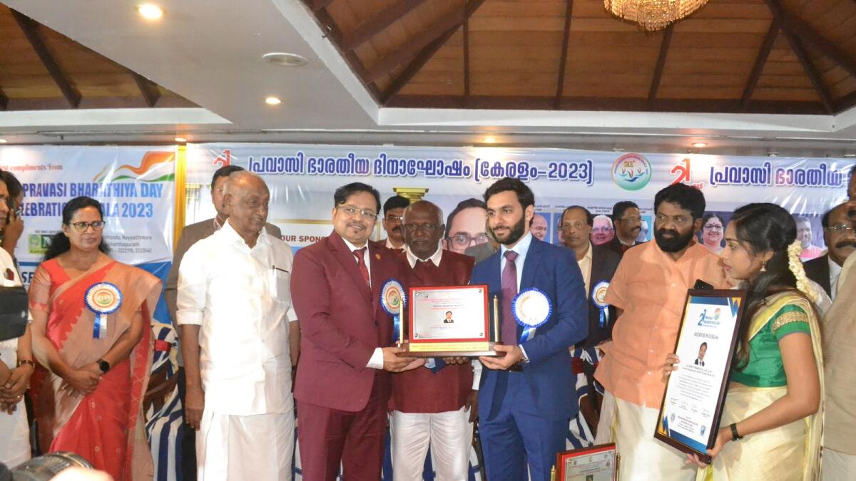 Syam P Prabhu, founder and managing director receiving the Pravasi Bharathi Karma Shresta Award 2023 from Hamad Abdulla Alhebsi, vice-consul at Consulate General of the UAE in Kerala